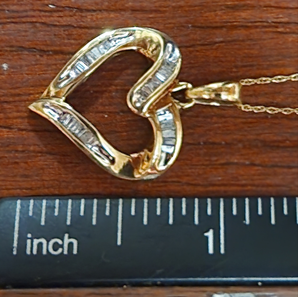 Stunningly 10k yellow gold 3/4 CT baguette heart necklace
